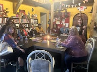 a group of people sitting around a table