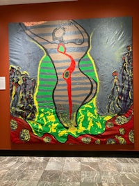 a painting of a woman on display in a museum